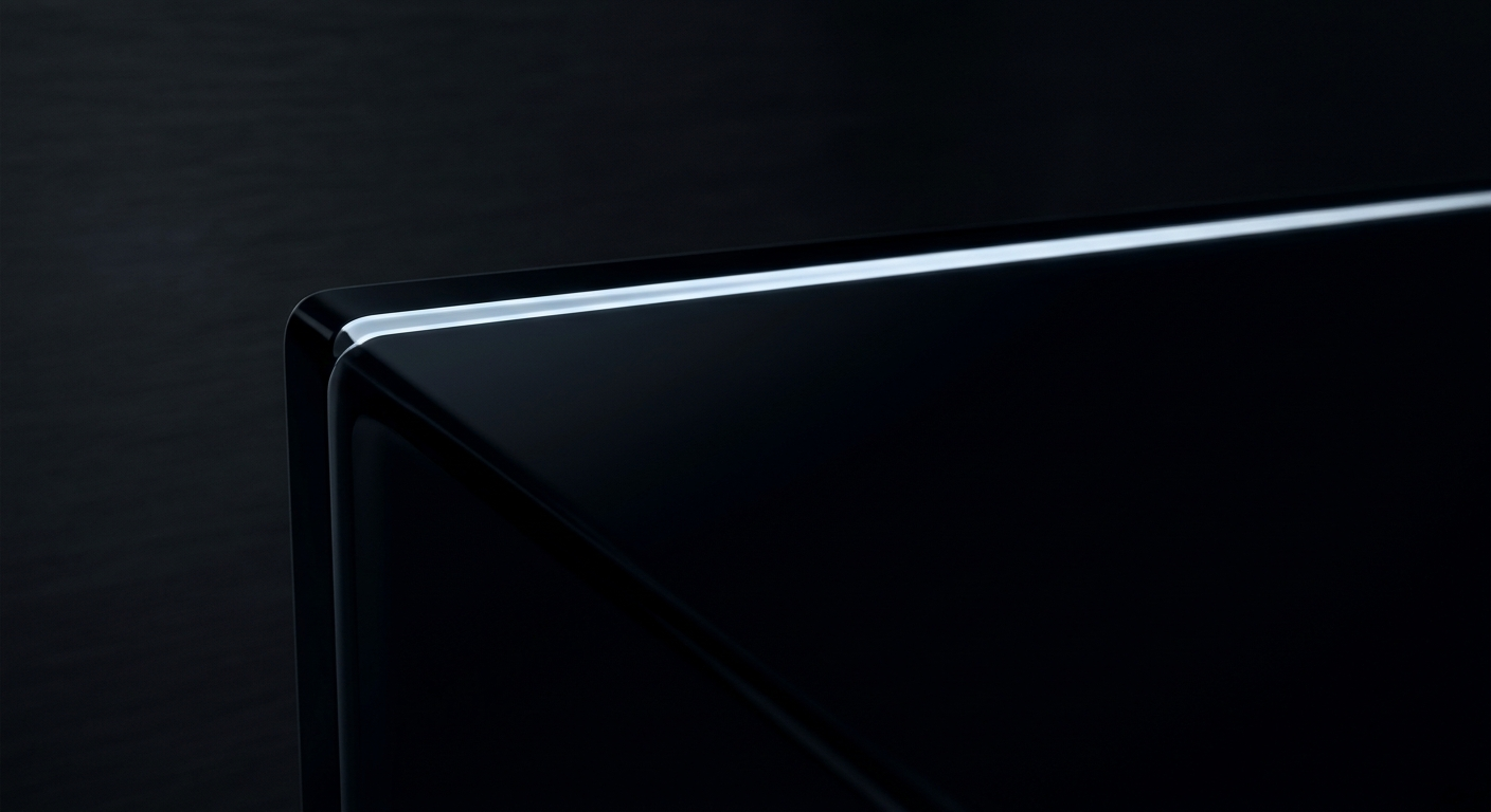 A hard ice-white specular edge tracing across polished near-black glass